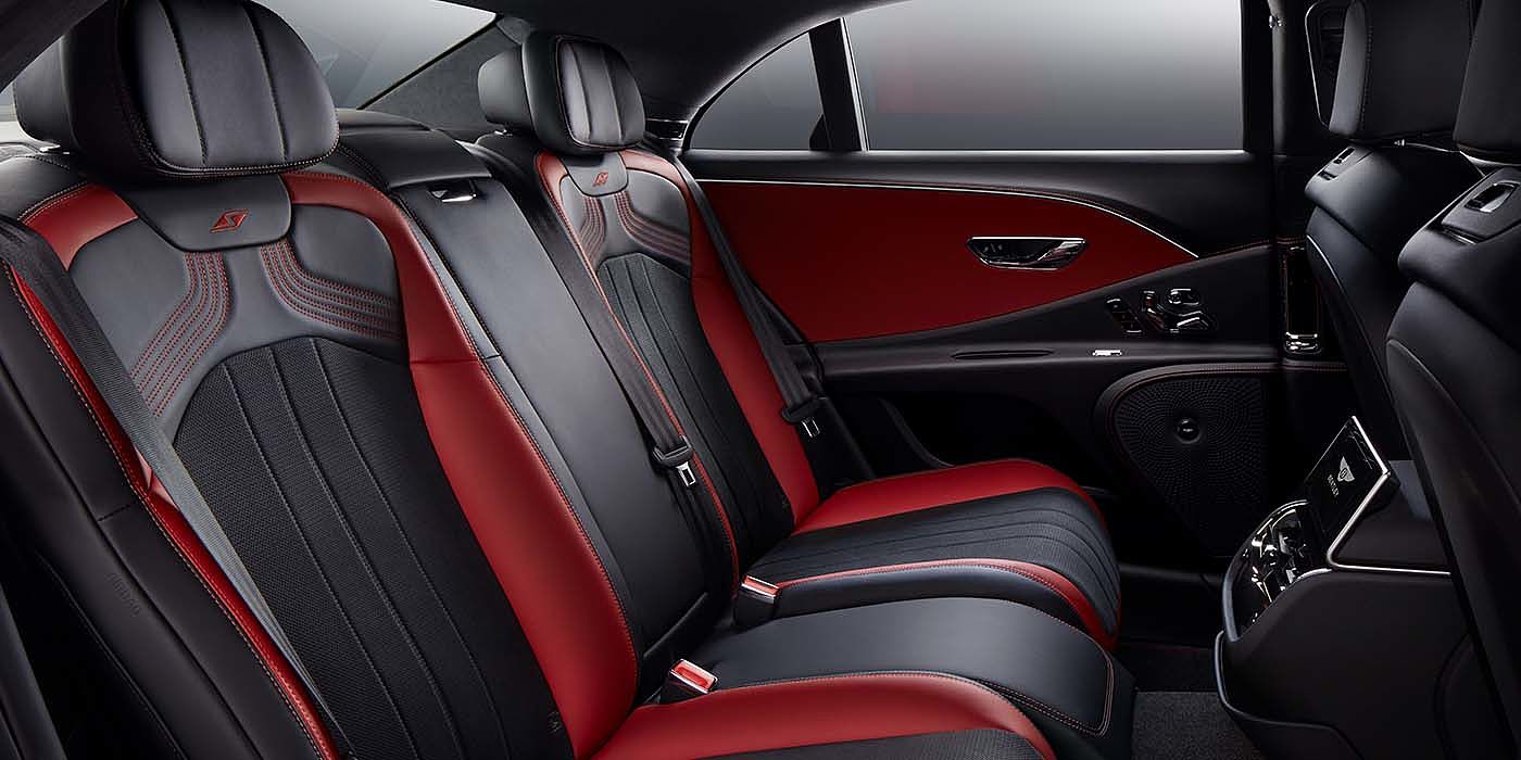 Bentley Copenhagen Bentley Flying Spur S sedan rear interior in Beluga black and Hotspur red hide with S stitching