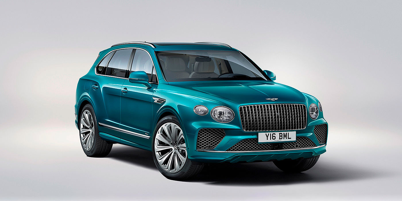 Bentley Copenhagen Bentley Bentayga Azure front three-quarter view, featuring a fluted chrome grille with a matrix lower grille and chrome accents in Topaz blue paint.
