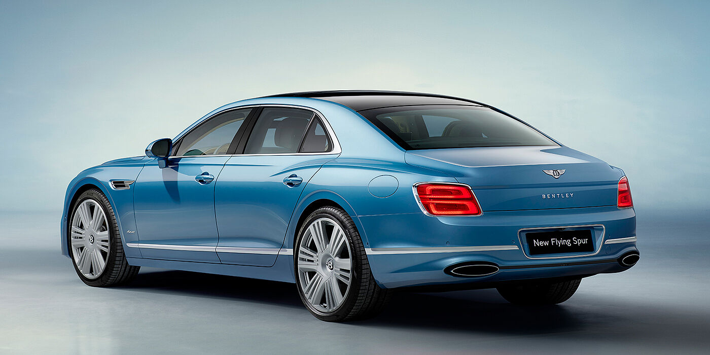Bentley Copenhagen New Bentley Flying Spur Azure sedan rear view in Light windsor blue by Mulliner paint with 22 inch Azure wheels and chrome exterior details