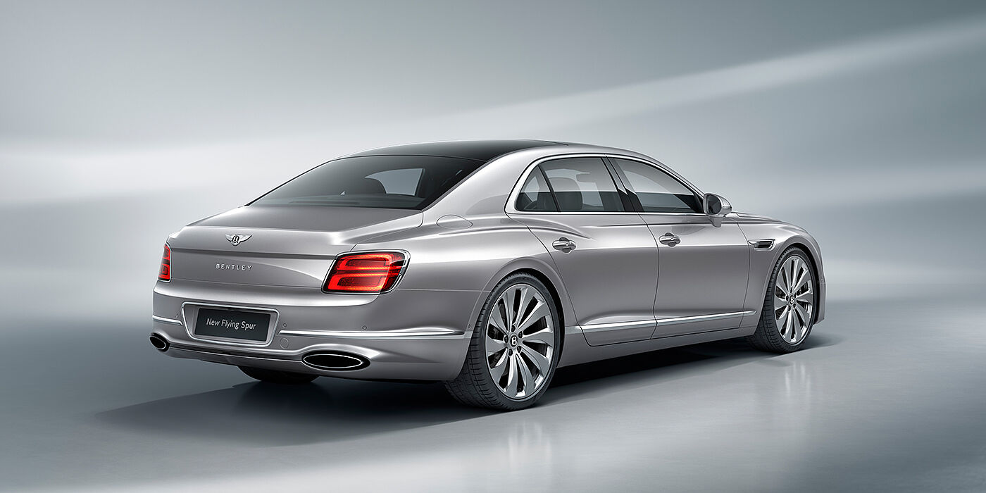 Bentley Copenhagen New Bentley Flying Spur sedan rear view in Silverlake paint with ten spoke wheels and chrome matrix grille