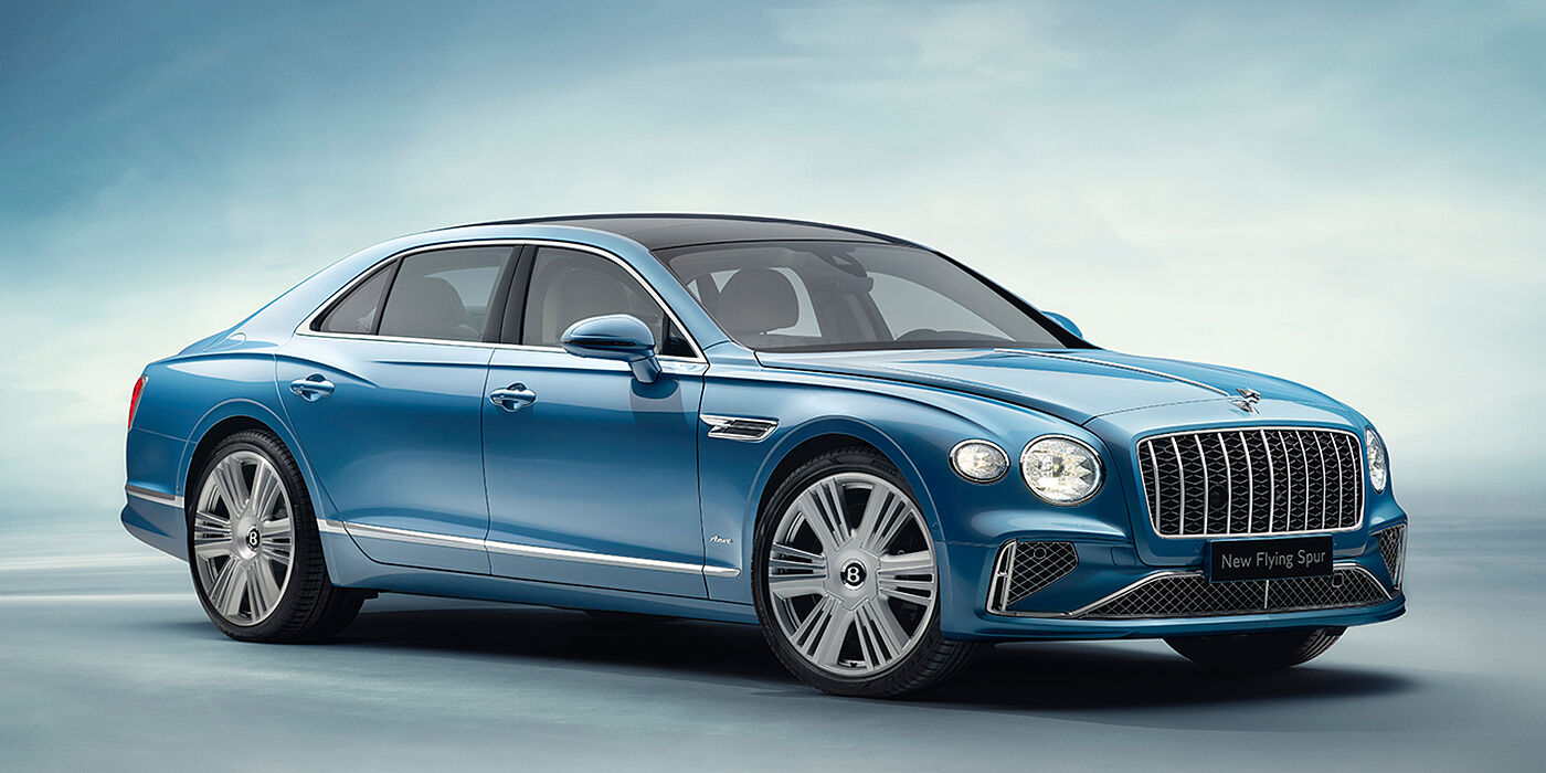 Bentley Copenhagen New Bentley Flying Spur Azure sedan front view in Light windsor blue by Mulliner paint with 22 inch Azure wheels and chrome exterior details