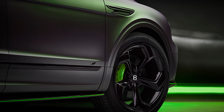 Bentley Copenhagen Bentley Bentayga S Black Edition SUV exterior wheel detail with Cyber Green brakes with Anthracite Satin paint