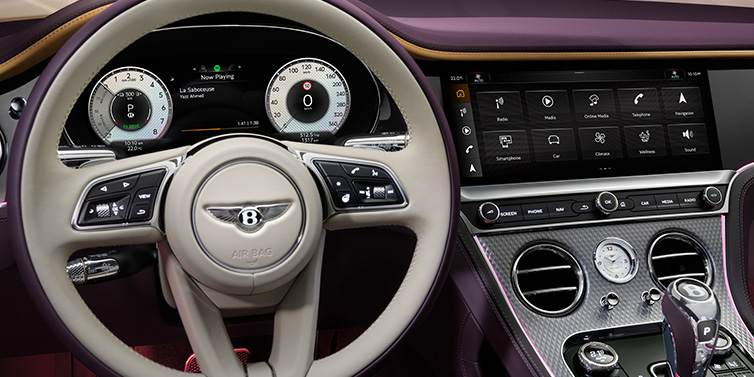 Bentley Copenhagen Bentley Continental GTC Mulliner convertible steering wheel and drivers screens surrounded by Damson purple and Linen hides